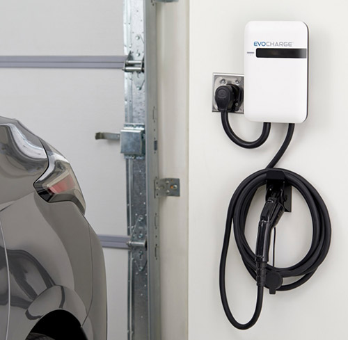 A photo of an EvoCharge installed in a home garage.