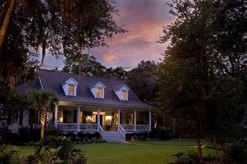 house at dusk with lights on