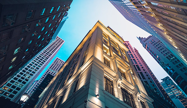 An image of commercial buildings in the dusk.